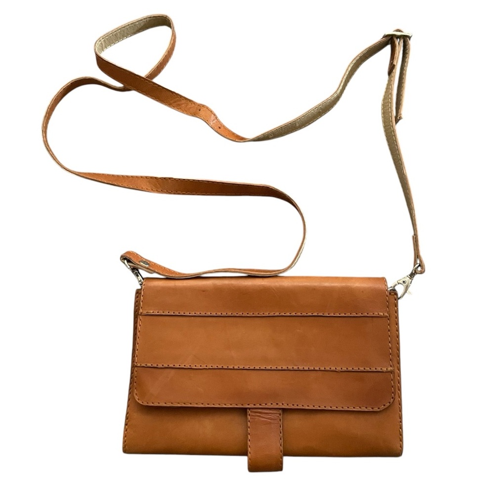 Handcrafted brown leather crossbody bag with adjustable strap & interior pocket